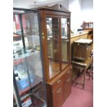 A Reproduction Mahogany Bookcase, broken pediment over glazed upper section with interior shelving