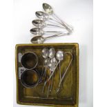 Silver- sugar tongs, six coffee and five teaspoons, two napkin rings.