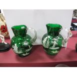 A Pair of Late Victorian Green Glass Jugs, each white enamelled in the Mary Gregory manner with