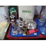 An Electroplated Three Section Serving Dish, three branch candelabra, goblets, brass tapersticks,