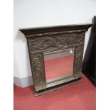Early XX Century Overmantel, with 52 x 50cms bevelled mirror, surrounded by carved mythological