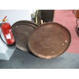 Three Large Middle Eastern Copper Coffee Table Trays, each with symmetrical and floral engraving,