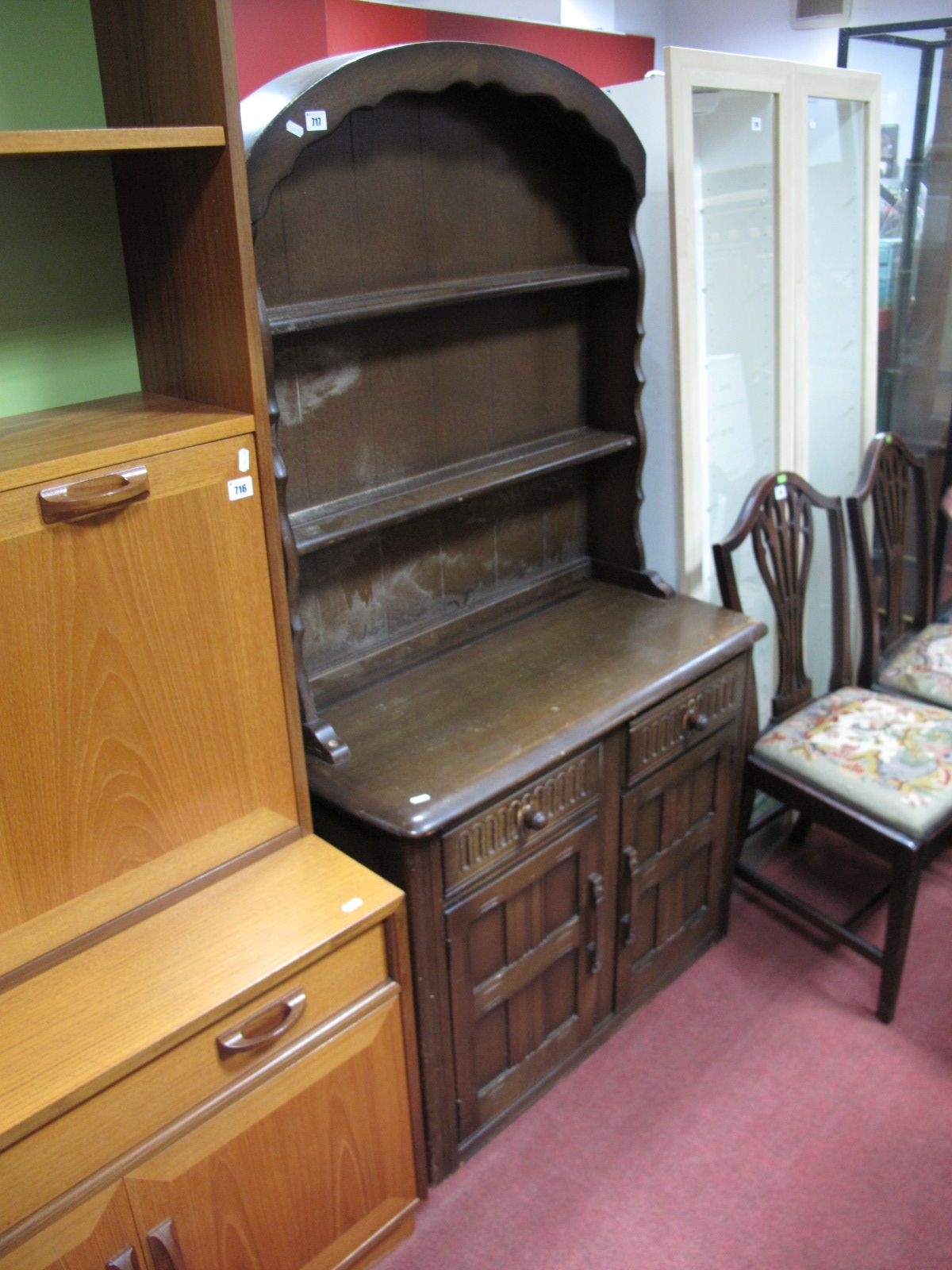 A XX Century Small Oak Dresser, rack with a domed top, two shelves, base with two small drawers,