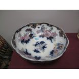 A Victorian Blue and White Footed Bowl, floral decorated highlighted in gilt.