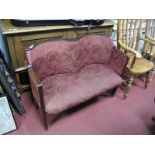 An Early XX Century Two Seater Salon Seat, with a shaped upholstered back, upholstered seat on
