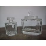 A Kosta Boda Clear Glass Jar and Cover, of slice cut oval form, height 12cms, and a similar scent