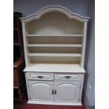 A Modern Cream Painted Dresser, with arched top and two drawers over two cupboard doors.