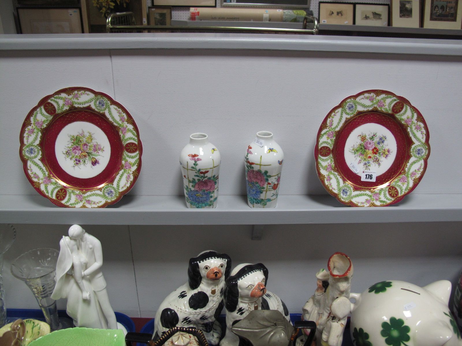 A Pair of Late XIX Century Sevres Style Cabinet Plates, polychrome painted with flowers on a gilt