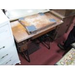 An Oak Cased Singer Treadle Sewing Machine.