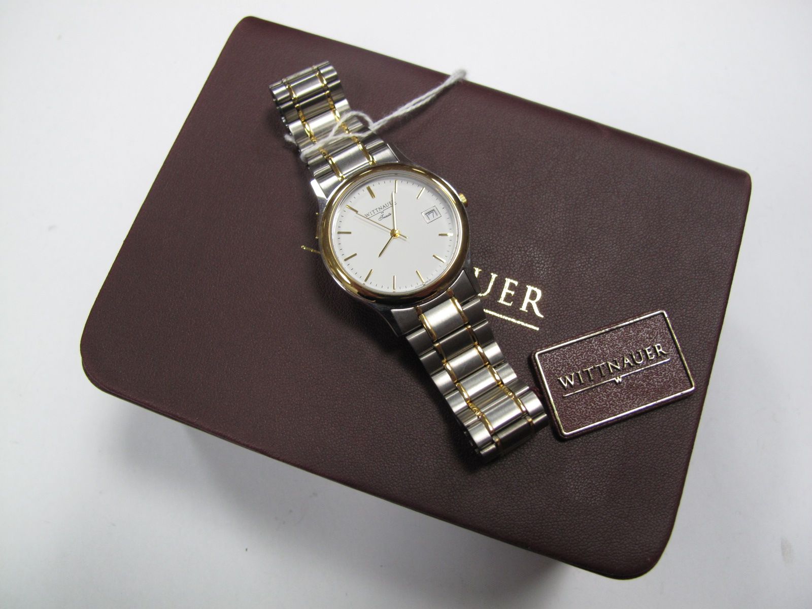 Wittnauer; A Modern Two Tone Gent's Wristwatch, the signed white dial with date aperture, to