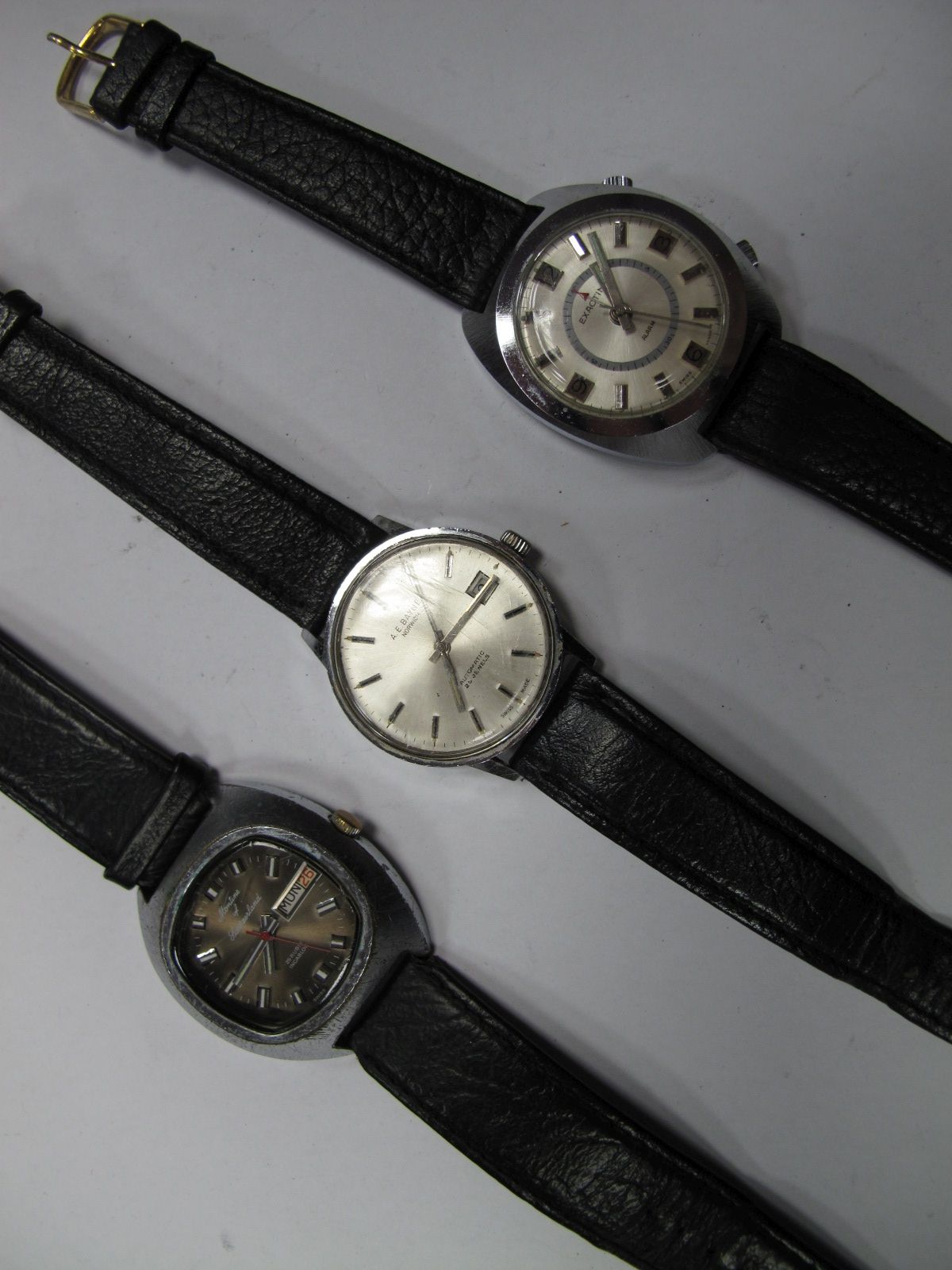 Exactima Alarm, Montine of Switzerland Automatic and A. E. Bayne Norwich Gent's Wristwatches. (3)