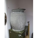 An Early XX Century Galvanized Tub, together with a galvanized clothes tub. (2)
