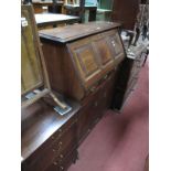 A XIX Century Mahogany Bureau, having panelled fall front with fitted interior, over three short