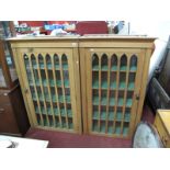 A Pair of XIX Century Stripped Pine Wall Hanging Bookcases, each with plain moulded cornice over