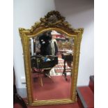 A Large Bevelled and Arched Rectangular Wall Mirror, gilt effect moulded frame with flame, arrow and