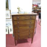 An Early XX Century Mahogany Chest of Drawers, with a moulded edge, six long drawers, on tapering