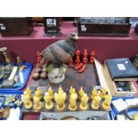 A South East Asian Chess Set, painted plaster bird modelled pieces, with foliate carved hardwood