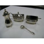 A Hallmarked Silver Three Piece Cruet Set, complete with matching spoon and another spoon.