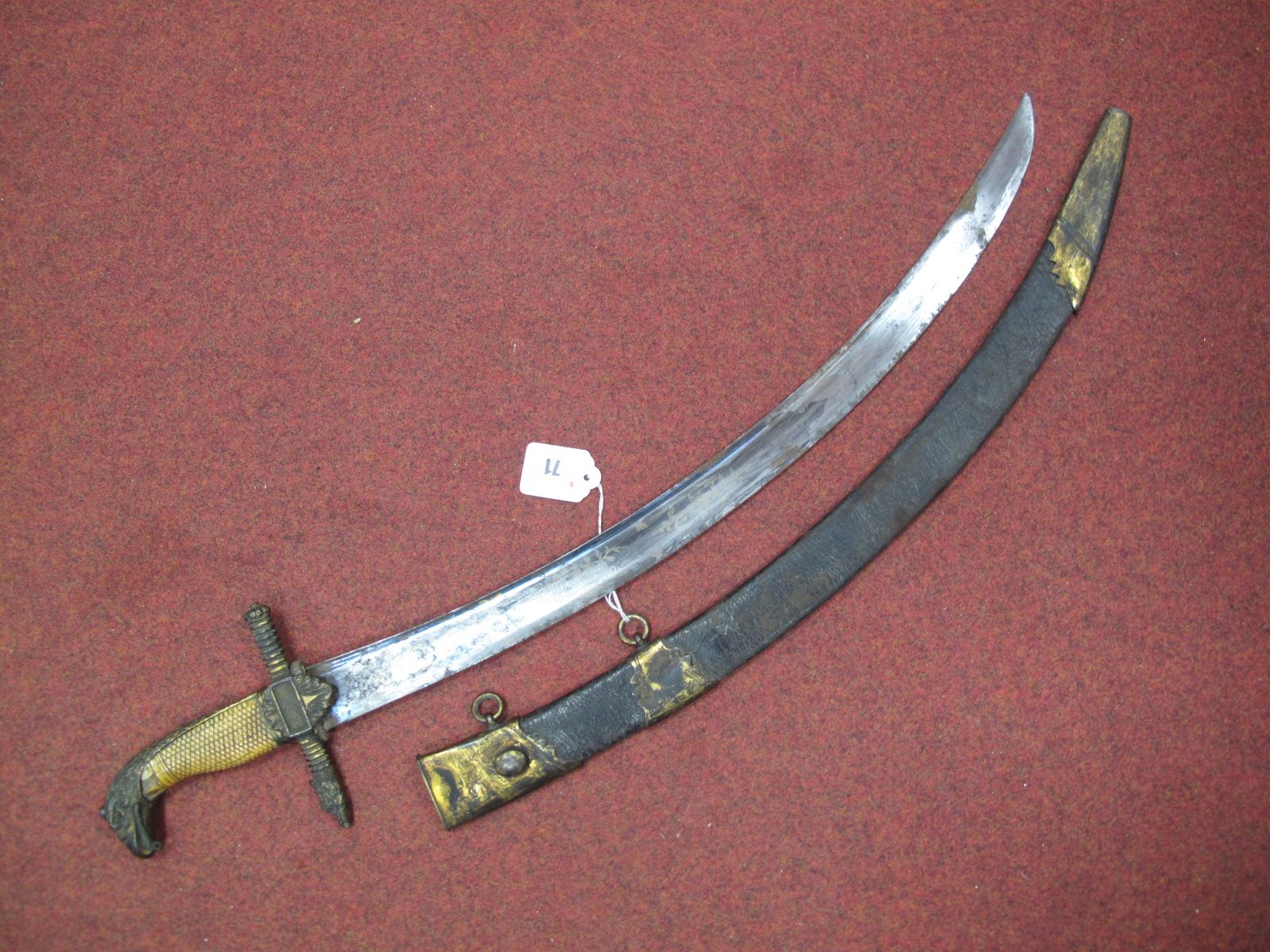 A Late XVIII Century Naval Officers Curved Short Sword, with etched blade gilt guard in dragon