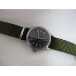 A Second Part XX Century British Military Wristwatch by Vertex, the black dial with War Department