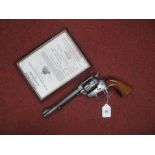 An Uberti of Italy 0.22" Calibre Revolver, No.36054, barrel length 5¾inches with wooden grip,