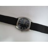 A 1970's British Military Wristwatch by Hamilton, the black dial with War Department arrow, the case