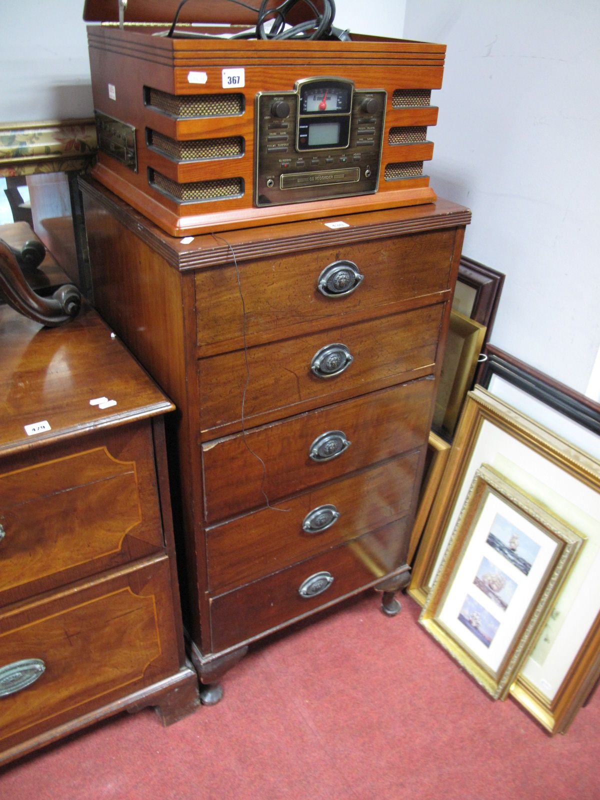A Mahogany Chest of Drawers, with five small drawers, on cabriole legs.