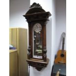 XIX Century Walnut Viennese Wall Clock, with carved top and reeded plaster supports, black Roman