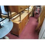 A Teak Sideboard, with sliding doors.