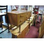 A 1960's Teak Sideboard, having six short drawers to frieze on square tapering legs.