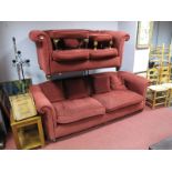 Two Wine Coloured Upholstered Settees, together with two stools.