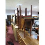 A Circa 1980's Teakwood Drop Leaf Dining Table, oval top on turned tapering legs, and four dining