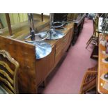 A 1960's Bow Fronted Teak Sideboard, having a bank of three central short drawers and flanking