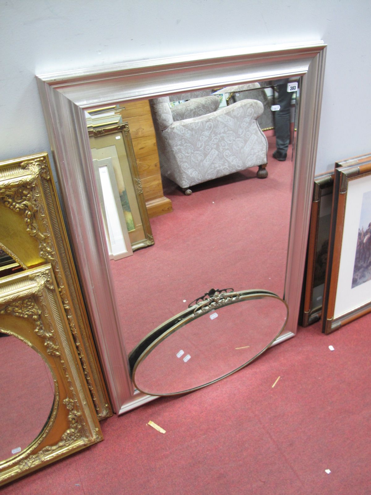 A Rectangular Wall Mirror, in silvered effect frame and an oval wall mirror. (2)