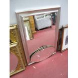 A Rectangular Wall Mirror, in silvered effect frame and an oval wall mirror. (2)