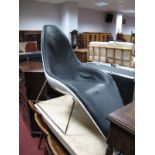 A Mid to Late XX Century Egg Chair Style Leather Recliner, on chrome supports.