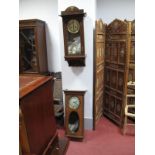 An Early XX century Oak Cased Eight Day Wall Clock, silvered dial, and a further wall clock. (2)