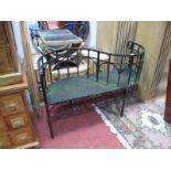A XX Century Black Painted Cast Metal Garden Love Seat, shaped scroll arms, arched frieze,