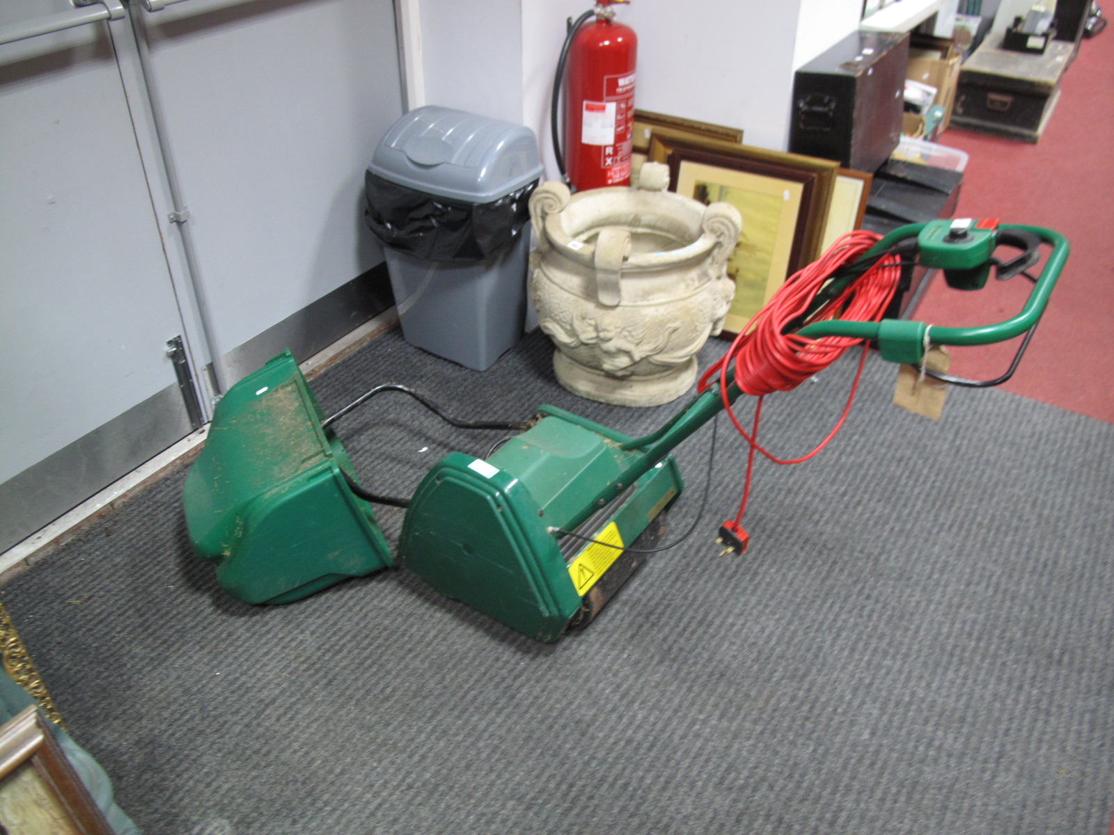A Qualcast Electric 305 Lawn Mower, with grass basket.