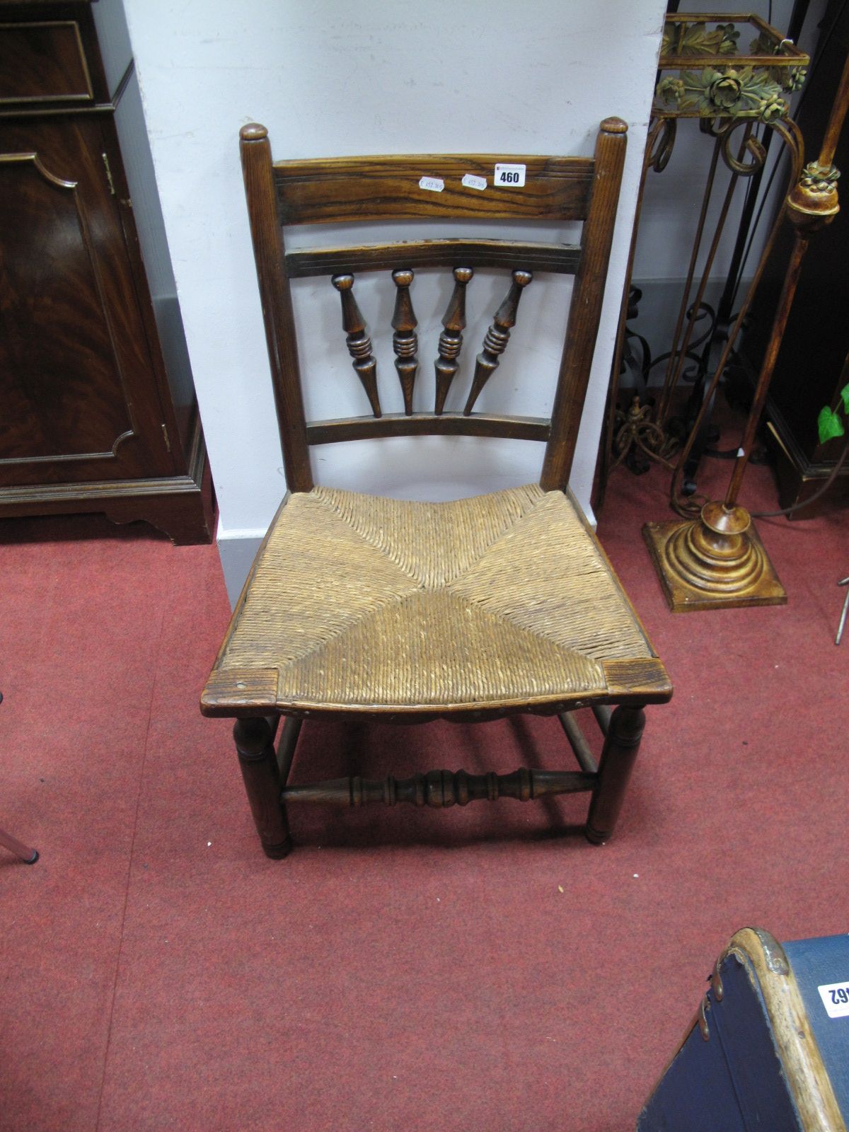 A XIX Century Elm Country Rush Seated Chair, plain bar back unit splayed ring turned spindles,
