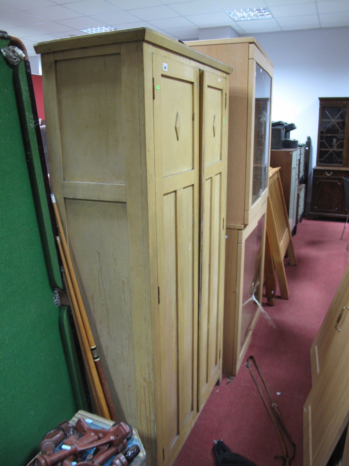 An Early XX Century Pine Kitchen Cupboard, with twin doors on block supports.