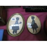 Two XIX Century Silhouette of Young Children, one with an open book, the other with a small