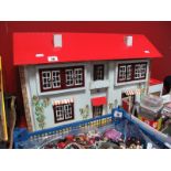 A Mid XX Century Double Fronted Dolls House, by Geebee Toys, Hull, England, 62cms wide, 23cms