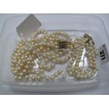 A Three Row Pearl Bead Necklace, (strings broken/beads missing) to snap clasp stamped "14K";