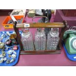 1930's Oak Tantalus, with plated mounts, three hobnail decanters (one cracked), with key.