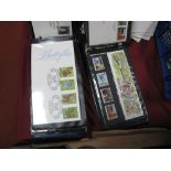 Royal Mail Mint Stamps, 1980's issues, together with similar first day covers, in two albums.