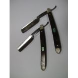 Two c.1930's Cutthroat Razors, capped rosewood scales, with inlaid shield, machine forged 3/4"