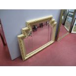 A Cream and Gilt Art Deco Style Bevelled Wall Mirror.