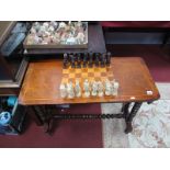 A Victorian Mahogany Games Table, chequer board top, boxwood stringing on turned supports, united by