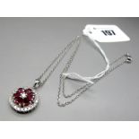 A Modern 18ct White Gold Ruby and Diamond Set Pendant, of circular cluster design, claw set with